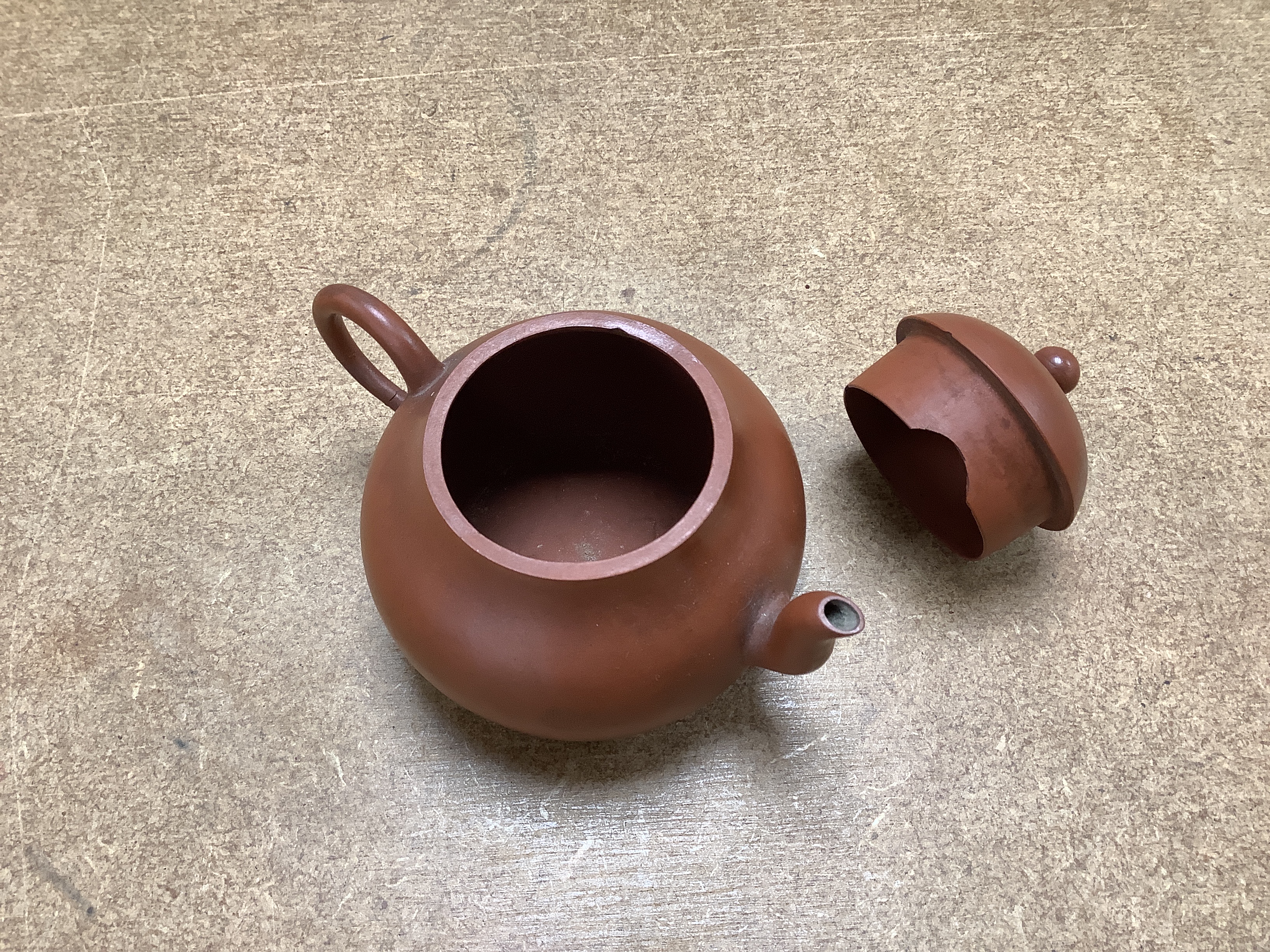 Six Chinese Yixing terracotta teapots, largest 11cm